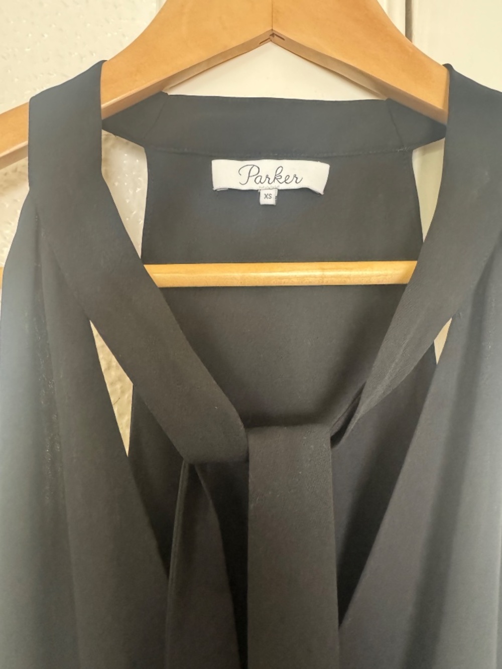 PARKER - black ruffle front sleeveless black dress with tie detail at neck XS